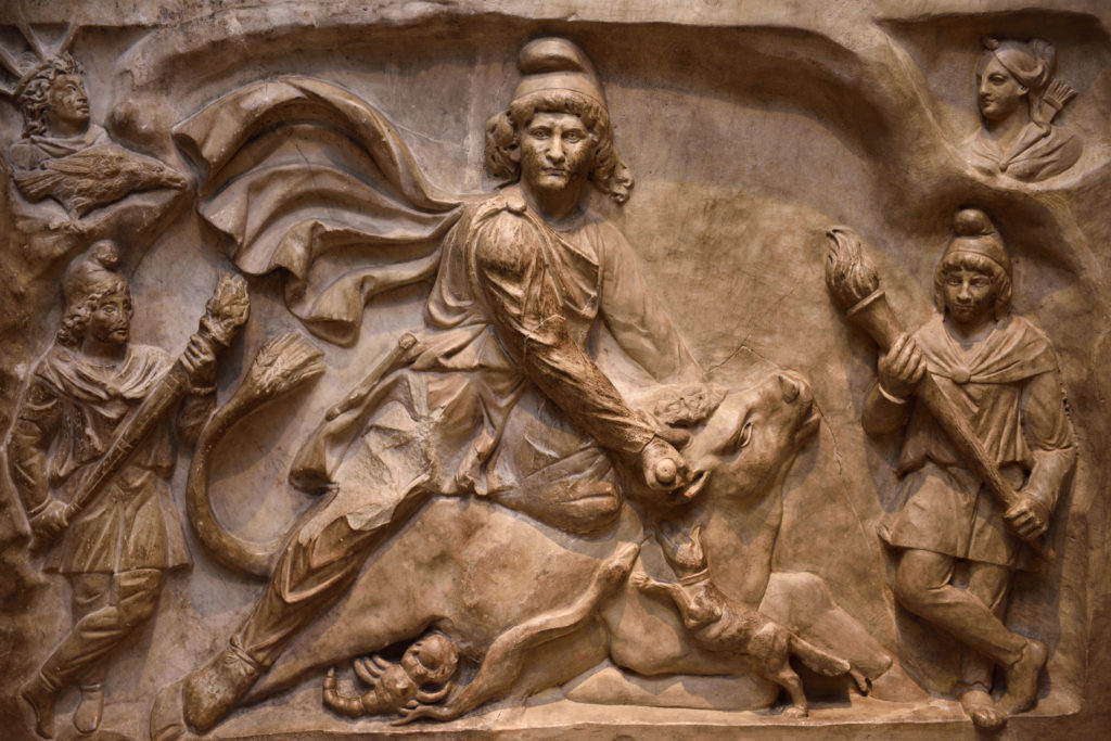 Marble relief carving of the Tauroctany at ROM Toronto.  The carving depicts Mithras looking out at the viewer as he slays the bull.