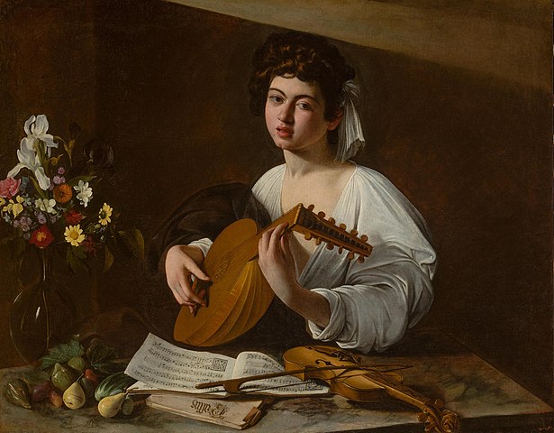 The Lute Player by Caravaggio - a man sits soulfully playing a lute.  The man, who many have mistaken for a woman, may be the Spanish castrato Pedro Montoya.  A sheet of music depicting a love song sits on a table in front of him.  The players white shirt and bright skin contrast heavily with the dark background.
